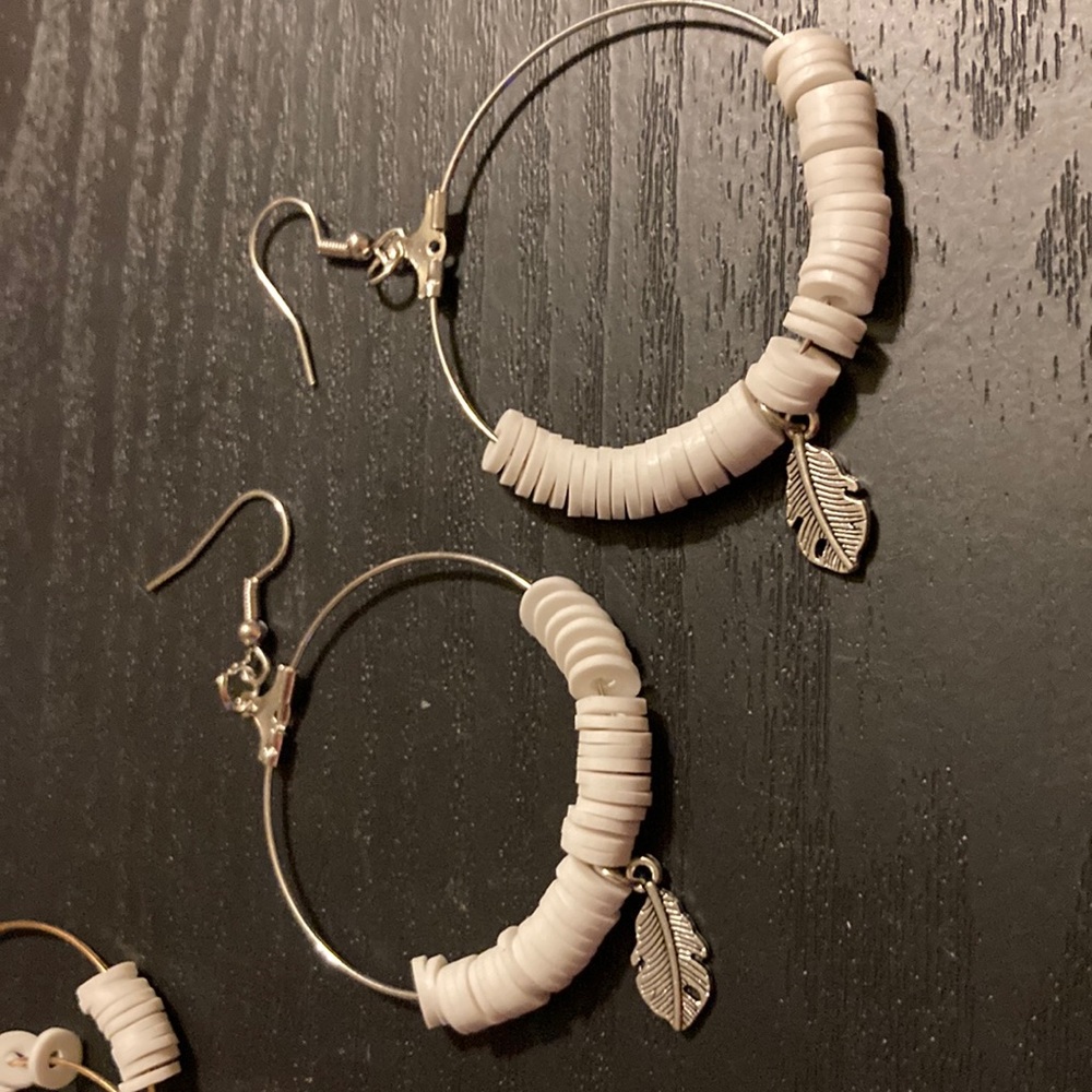 Feather charm earrings